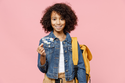 Young girl holding the True Youth Debit Card